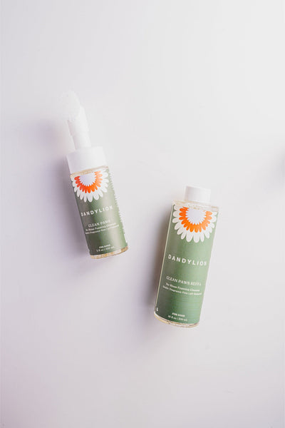 Dandylion refill foaming cleanser for pet paws bottles with green labels and white caps for dog grooming