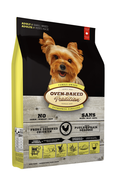 Oven-Baked adult small breed chicken dog food in a yellow and black bag with a Yorkie on the label