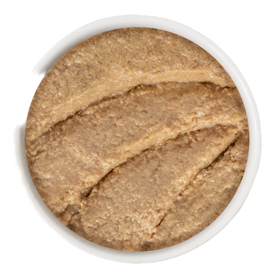 Smooth texture of Weruva Play canned cat food in a white bowl for feline nutrition