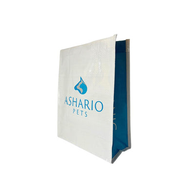 White and blue Ashario Pets reusable bag with logo for eco-friendly pet product storage