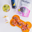 Crumps' Natural dehydrated lamb chop for dogs displayed on a bone-shaped mat with other pet food items
