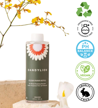 Dandylion refill foaming cleanser for pet paws in green bottle with floral design on black background