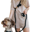 Woman holding a dog with dexypaws hands free dog leash black in a casual outfit