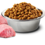 Farmina lamb and blueberry dog food in a silver bowl with kibble and fresh lamb chunks