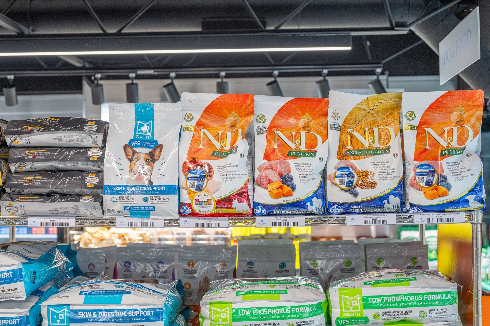 Farmina lamb blueberry dog food bags on display with various flavors and nutritional support options