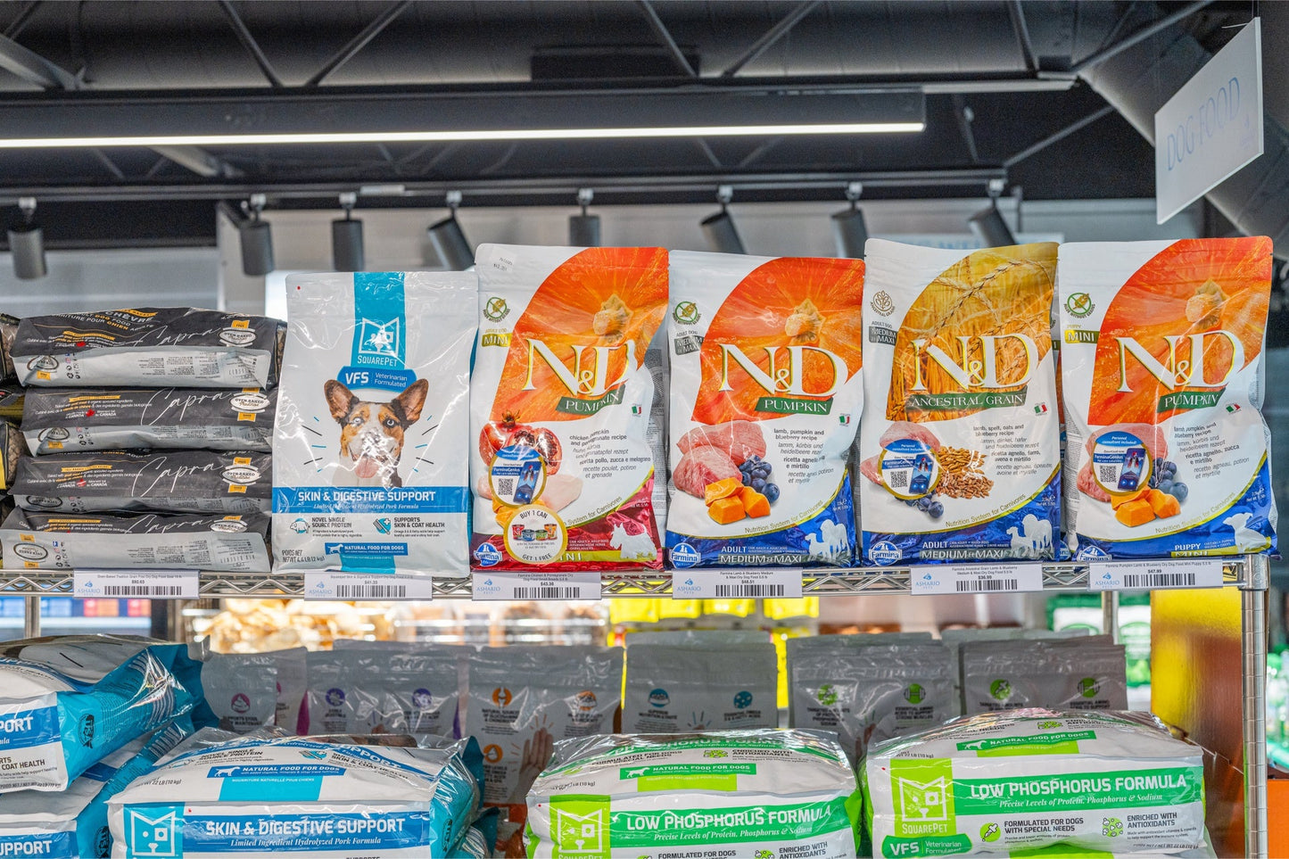 Farmina pumpkin lamb mini puppy food bags displayed on a shelf for pet nutrition