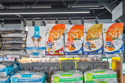 Farmina pumpkin lamb mini puppy food bags displayed on a shelf for pet nutrition