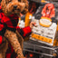Oven Baked Tradition oven baked dog chicken food for seniors displayed in a store with a happy dog