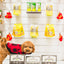 RedBarn hydrant small dog treats displayed in open boxes with a brown curly dog wearing a red and black jacket nearby