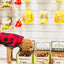 Dog sniffing RedBarn Chew a Bulls brush treats boxes displayed on the floor in a pet store