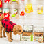 Curly dog in red plaid jacket sniffing boxes of redbarn small dog chew a bulls brush treats in pet store