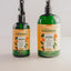 TropiClean Jojoba oil dog shampoo and refreshing spray in green bottles for dog grooming