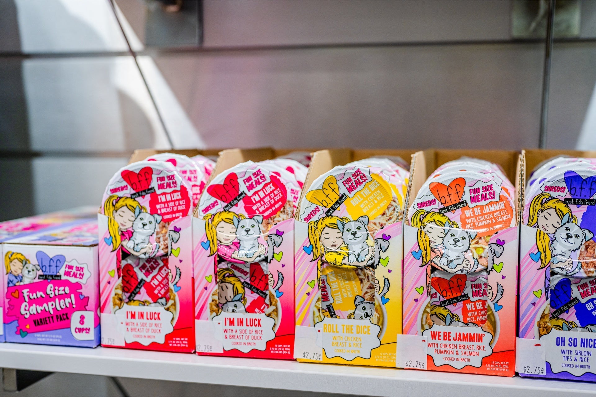 Weruva I'm in Luck dog food pack among colorful varieties on display for pet lovers