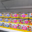 Weruva OMG Stir canned cat food variety pack on store shelf with colorful packaging